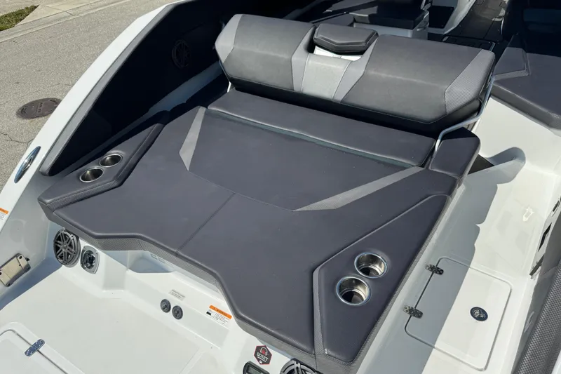 Slide: The Image of 2022 Scarab 285 ID boat interior with cushioned seating and cup holders. - 70