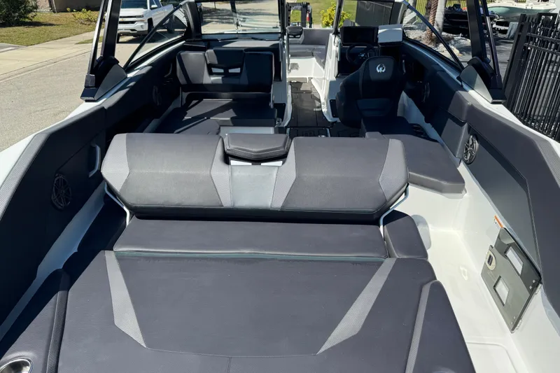 Slide: The Image of 2022 Scarab 285 ID boat interior with sleek seating and modern dashboard design. - 73