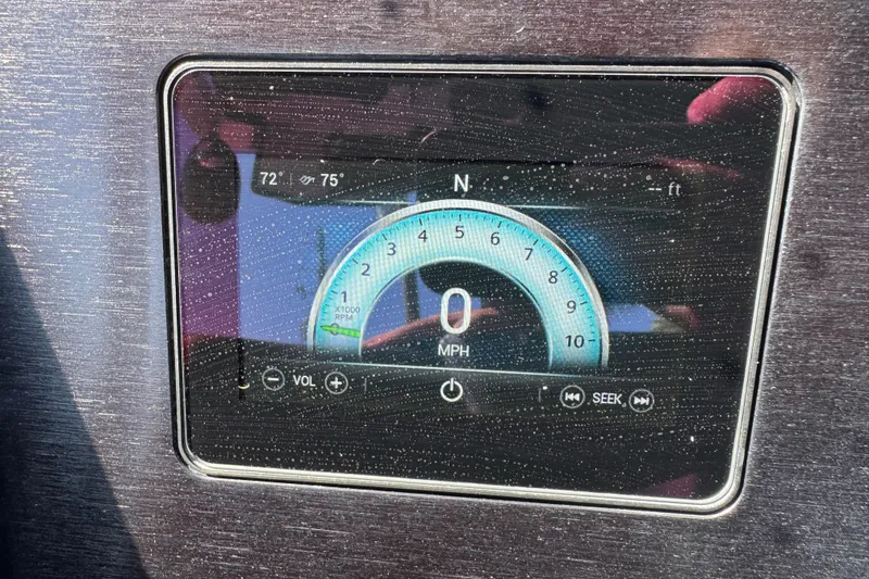 Slide: The Image of Dashboard display of a 2022 Scarab 285 ID showing speedometer and controls. - 78