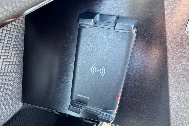 Slide: The Image of Wireless charging pad in 2022 Scarab 285 ID boat interior. - 79