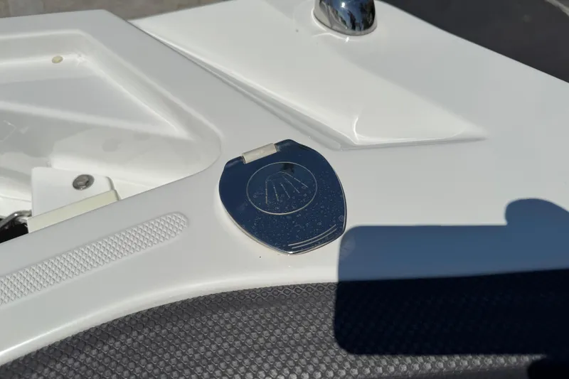 Slide: The Image of 2022 Scarab 285 ID boat detail with chrome accent and textured surface. - 83