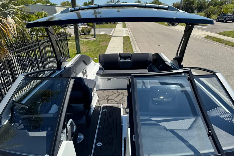 Slide: The Image of 2022 Scarab 285 ID boat interior with open canopy and seating area. - 84