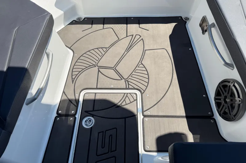 Slide: The Image of 2022 Scarab 285 ID boat interior with custom flooring and speaker detail. - 89