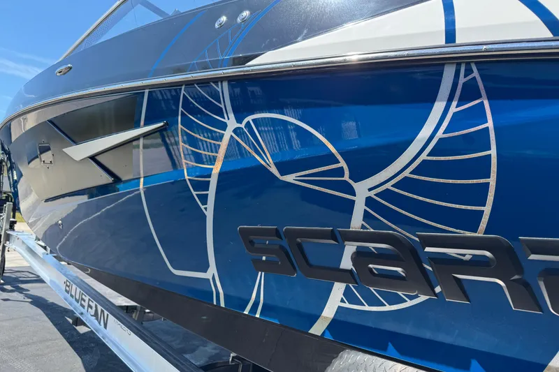 Slide: The Image of 2022 Scarab 285 ID boat with sleek blue design and modern graphics. - 98
