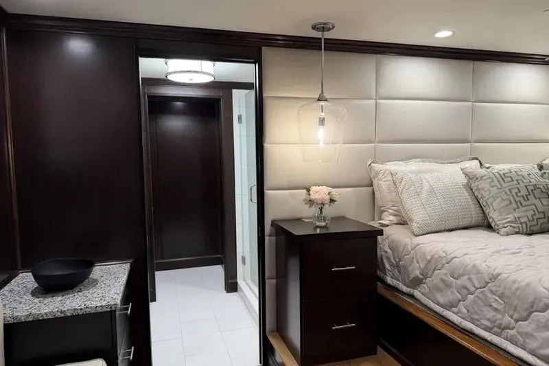Slide: The Image of Luxurious 2019 Sumerset houseboat bedroom with elegant decor and modern lighting. - 11