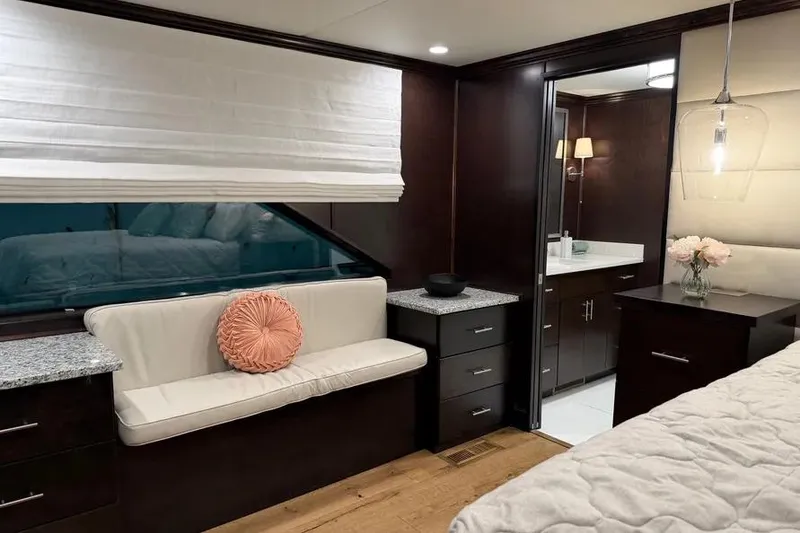 Slide: The Image of Luxurious 2019 Sumerset houseboat interior with modern decor, featuring a cozy seating area and elegant lighting. - 12