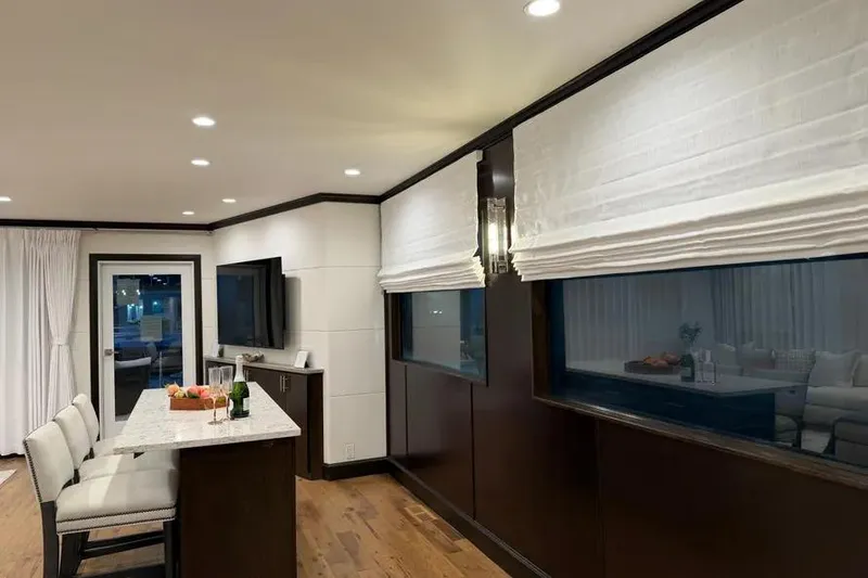 Slide: The Image of Luxurious interior of a 2019 Sumerset houseboat with modern kitchen and elegant decor. - 16