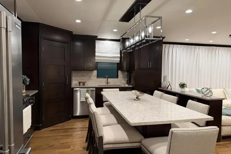 Slide: The Image of Luxurious kitchen interior of a 2019 Sumerset Houseboat, featuring modern design and elegant furnishings. - 17