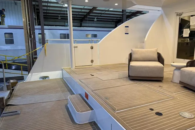 Slide: The Image of 2019 Sumerset Houseboat interior with modern seating and spacious deck area. - 24