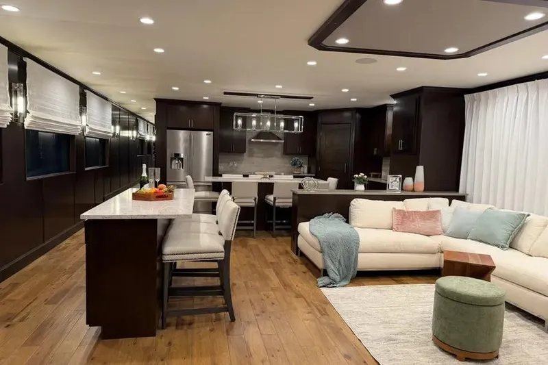 Slide: The Image of Luxurious interior of a 2019 Sumerset Houseboat, featuring modern kitchen and cozy living area. - 25