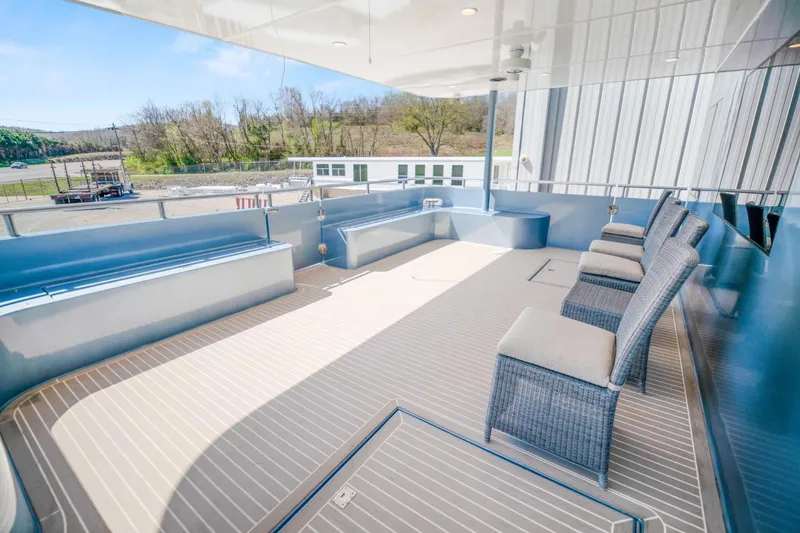 Slide: The Image of Luxurious 2019 Sumerset 20x100 houseboat deck with seating and scenic views. - 26