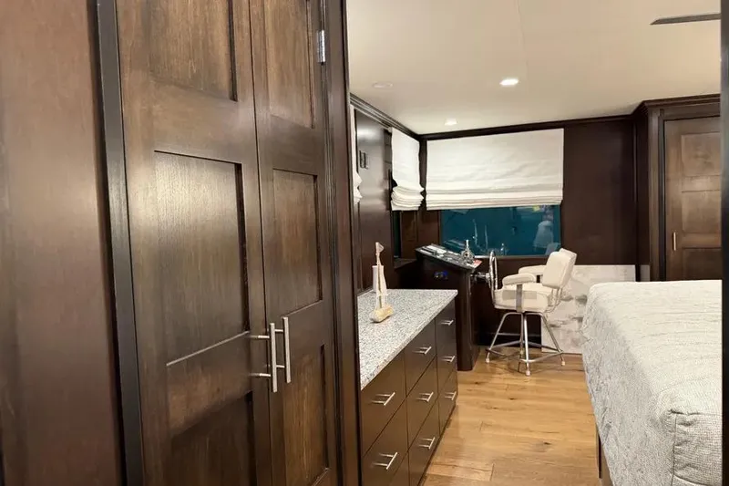Slide: The Image of Luxurious interior of 2019 Sumerset Houseboat with modern furnishings and wood finishes. - 8