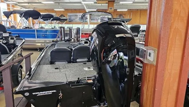 Slide: The Image of 2026 Tracker Pro Team 175 TF boat in showroom. - 11
