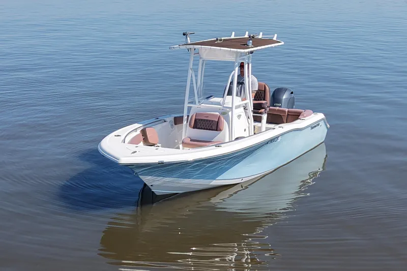 Slide: The Image of 2017 Tidewater 210 LXF boat on calm water, featuring sleek design and modern amenities. - 2