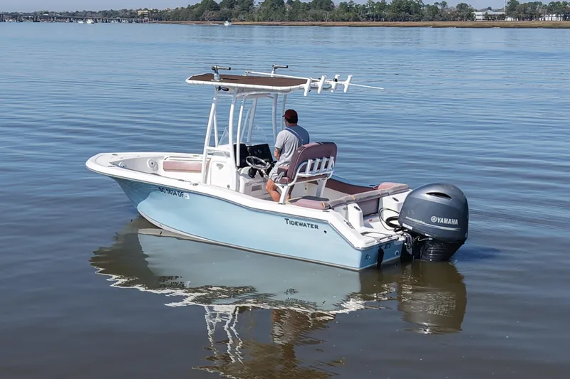 Slide: The Image of 2017 Tidewater 210 LXF boat with Yamaha engine on calm water. - 3
