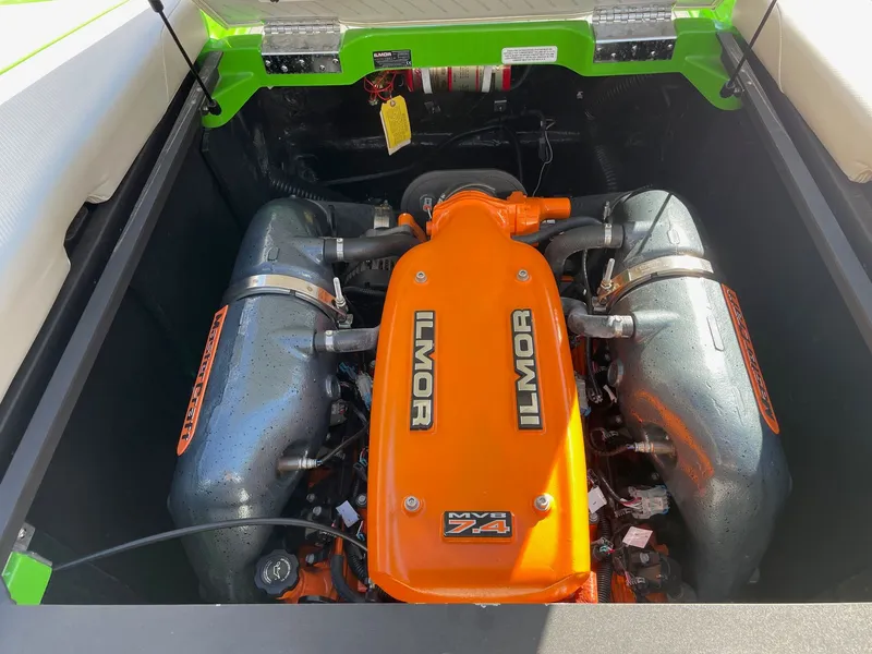 Slide: The Image of 2013 MasterCraft XStar Ilmor MV8 7.4 engine in vibrant orange. - 14