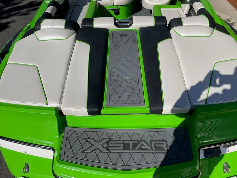 Slide: The Image of 2013 MasterCraft XStar boat with green and white interior. - 4