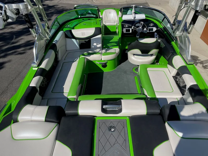 Slide: The Image of Interior of a 2013 MasterCraft XStar boat, green and white. - 5