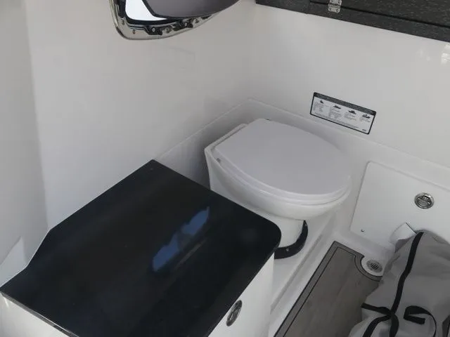 Slide: The Image of Interior of 2026 Monterey Elite 25 OB featuring a toilet. - 23