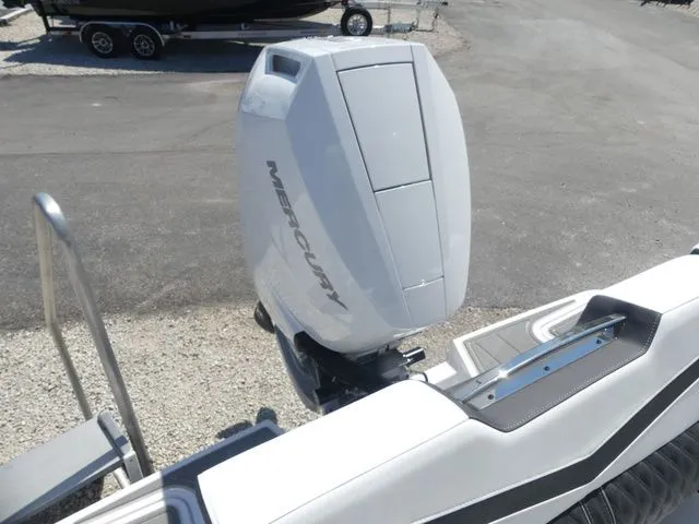 Slide: The Image of 2026 Monterey Elite 25 OB with Mercury outboard motor. - 6