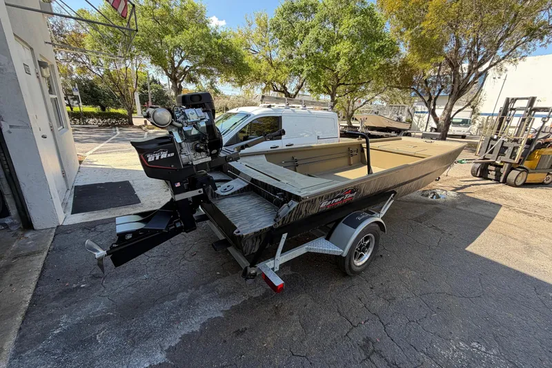 The Image of 2026 Gator Tail 1754 Extreme boat on trailer, parked outdoors. - 0