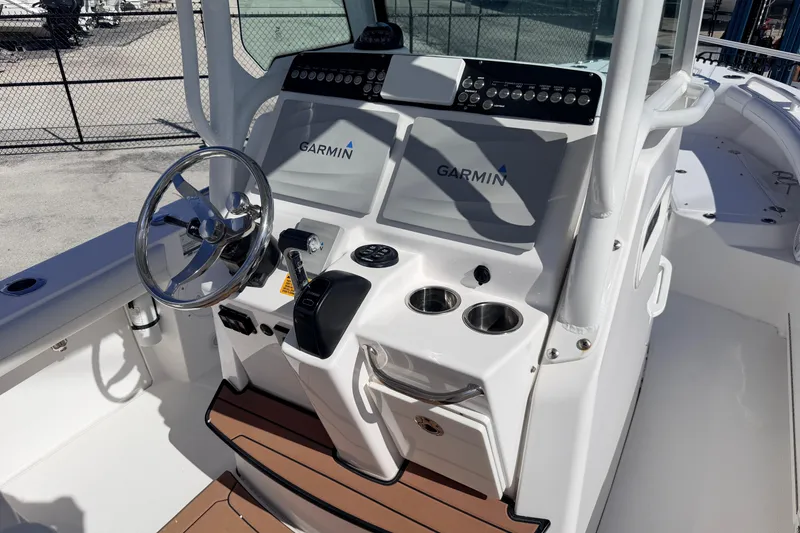 Slide: The Image of 2019 Everglades 253 Center Console boat dashboard with Garmin navigation system. - 17