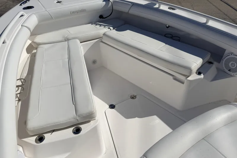 Slide: The Image of 2019 Everglades 253 Center Console boat interior with white cushioned seating. - 20