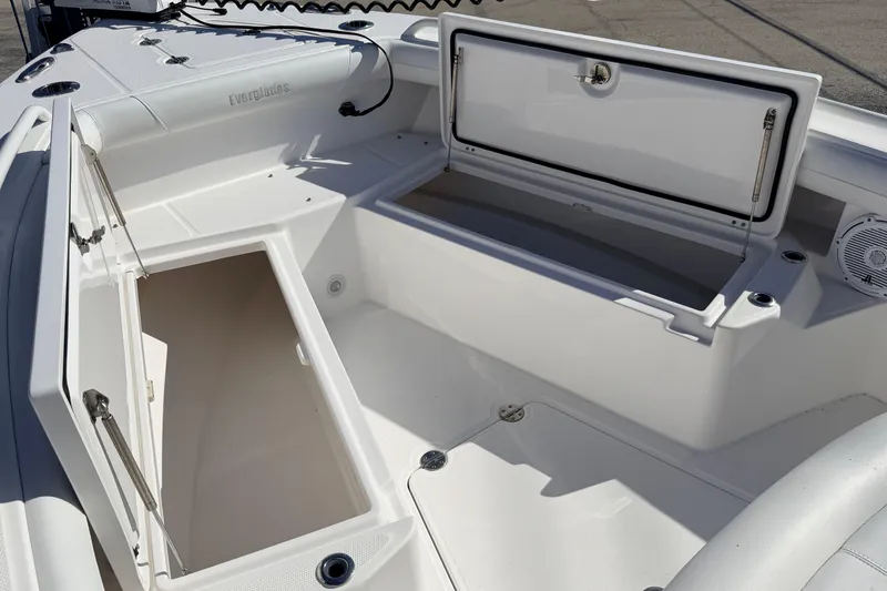 Slide: The Image of 2019 Everglades 253 Center Console boat with open storage compartments. - 22