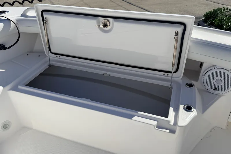 Slide: The Image of Open storage compartment on 2019 Everglades 253 Center Console boat. - 24