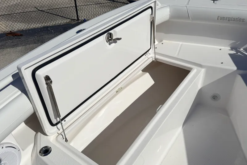 Slide: The Image of Open storage compartment on 2019 Everglades 253 Center Console boat. - 25