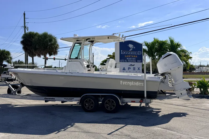 Slide: The Image of 2019 Everglades 253 Center Console boat on trailer at marina parking lot. - 3