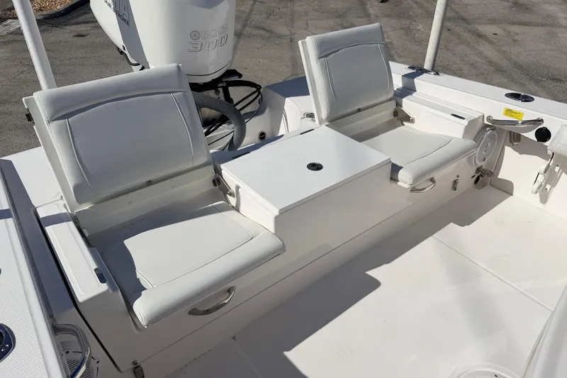 Slide: The Image of 2019 Everglades 253 Center Console boat with white seating and Yamaha 300 engine. - 9