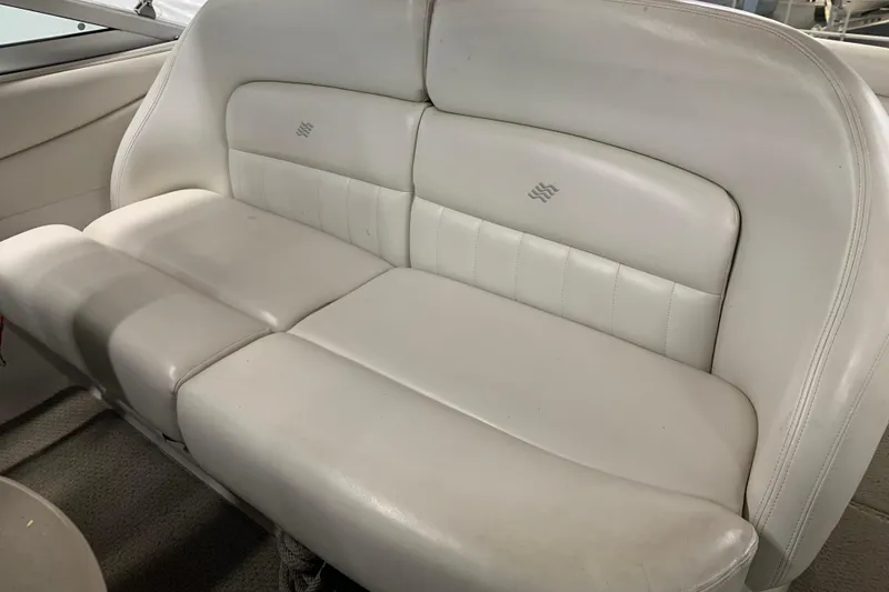 Slide: The Image of 2003 Four Winns 248 Vista boat interior with white leather seating. - 18