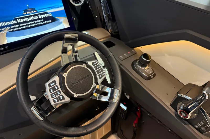 Slide: The Image of Steering wheel and controls of 2026 Saxdor 460 GTC boat with advanced navigation system. - 16