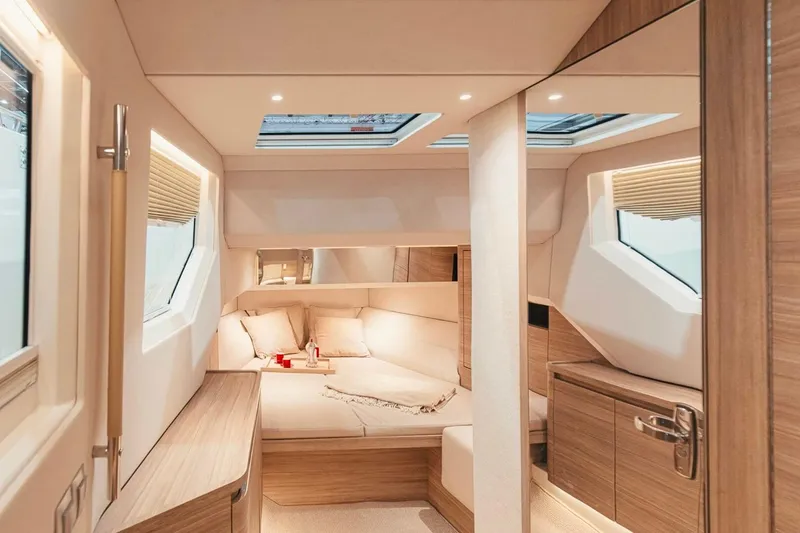 Slide: The Image of Luxurious interior of 2026 Saxdor 460 GTC yacht with modern wood finishes and skylights. - 17