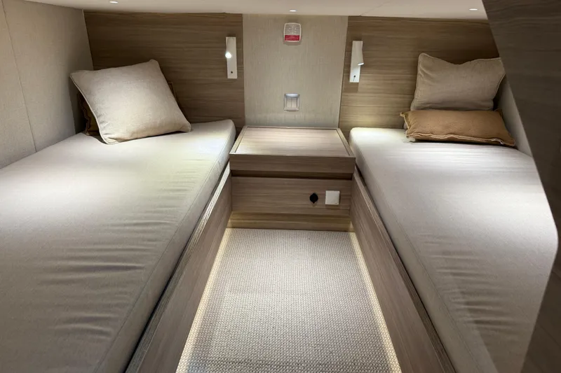 Slide: The Image of Modern twin cabin interior of 2026 Saxdor 460 GTC yacht, featuring sleek design and cozy bedding. - 23