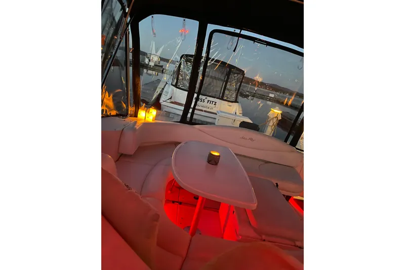Slide: The Image of Cozy interior of 2001 Sea Ray 380 Sundancer yacht with ambient lighting and candle. - 12