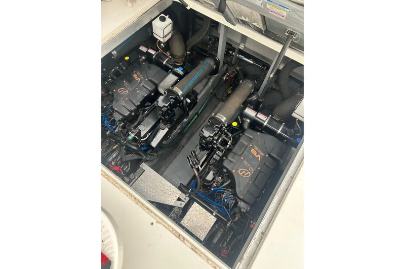 Slide: The Image of Engine compartment of a 2001 Sea Ray 380 Sundancer boat, showcasing dual engines. - 24