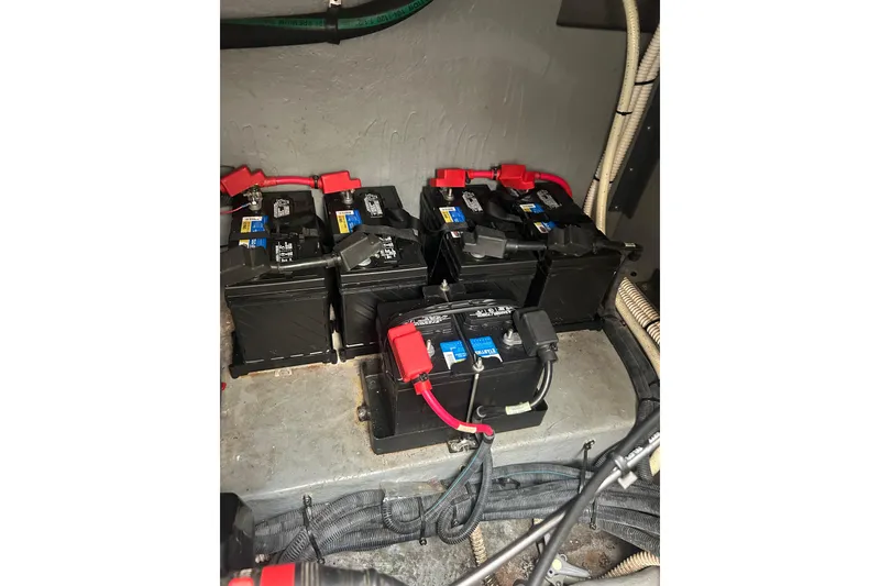 Slide: The Image of Batteries in a 2001 Sea Ray 380 Sundancer boat engine compartment. - 26