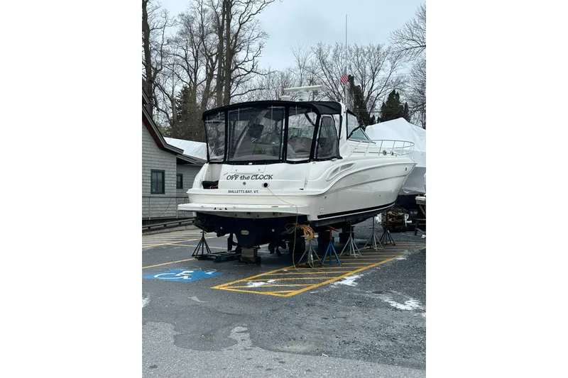 Slide: The Image of 2001 Sea Ray 380 Sundancer boat on stands in a parking lot. - 3