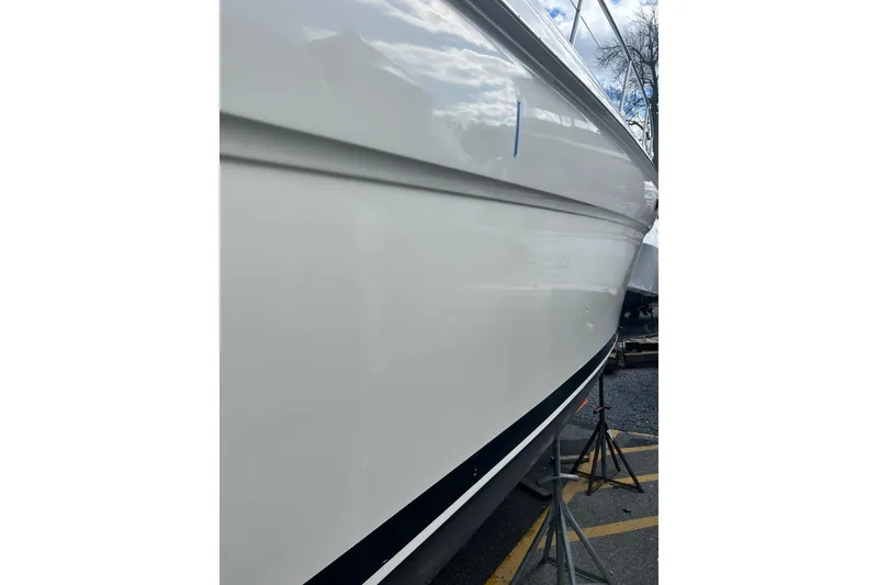 Slide: The Image of Side view of a 2001 Sea Ray 380 Sundancer boat on stands. - 6