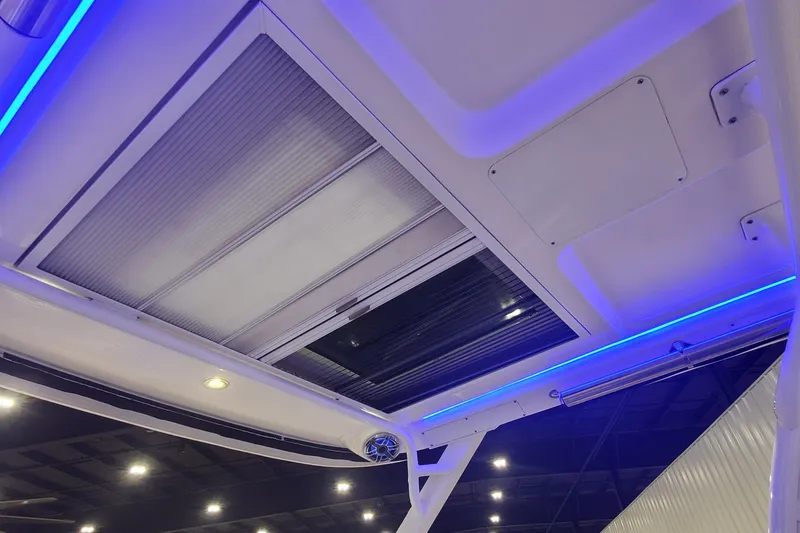 Slide: The Image of 2023 Chaparral 300 OSX boat interior ceiling with blue LED lighting. - 18