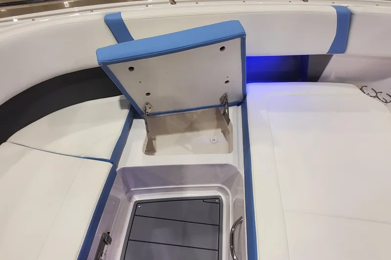 Slide: The Image of 2023 Chaparral 300 OSX boat seating with storage compartment open. - 29