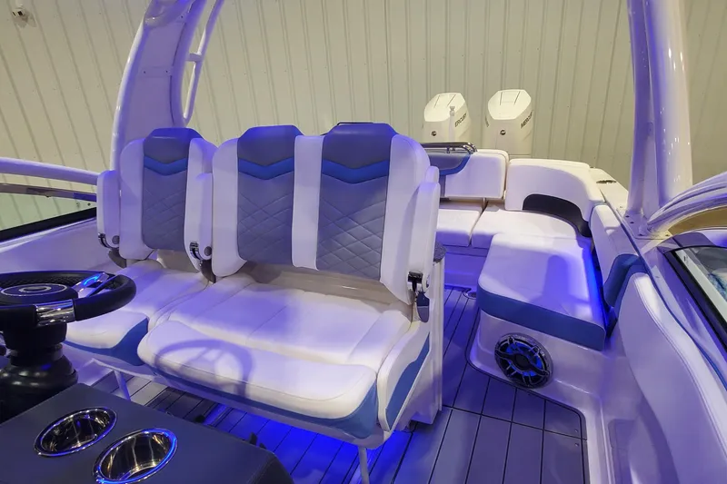 Slide: The Image of 2023 Chaparral 300 OSX boat interior with plush seating and modern design. - 34