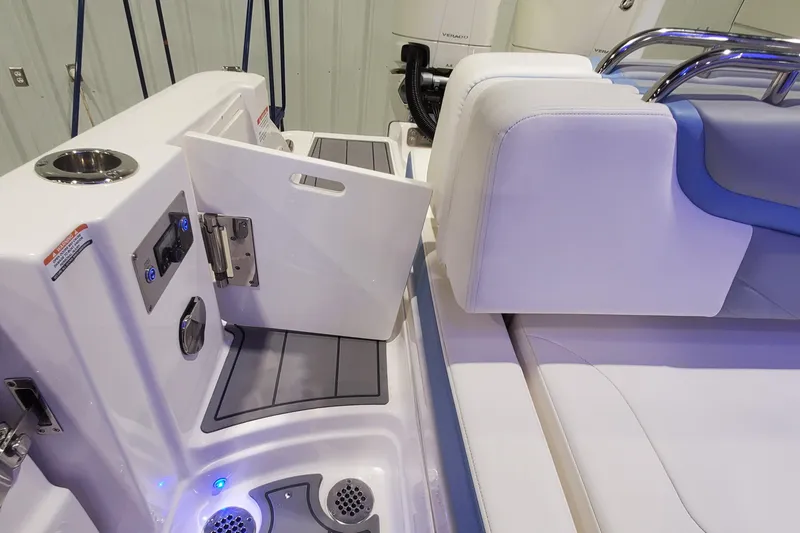 Slide: The Image of 2023 Chaparral 300 OSX boat interior with seating and storage compartment. - 36