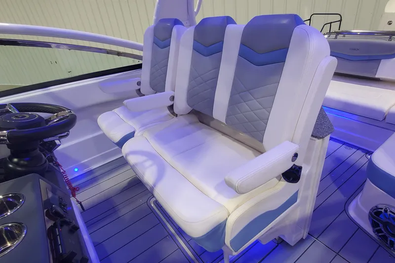 Slide: The Image of 2023 Chaparral 300 OSX boat interior with luxurious seating and modern design. - 39