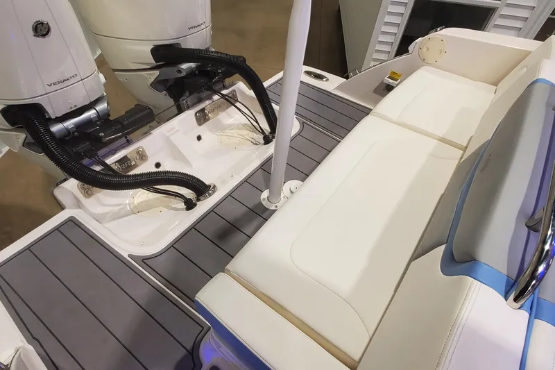 Slide: The Image of 2023 Chaparral 300 OSX boat interior with dual engines and cushioned seating. - 47