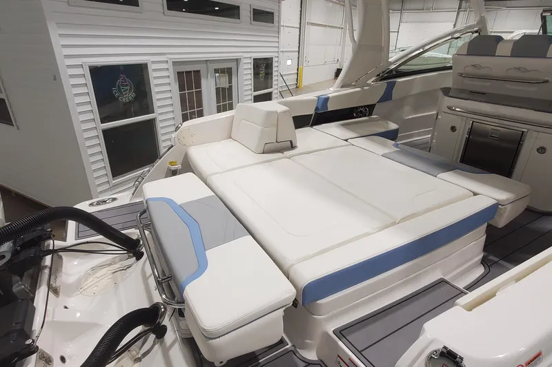 Slide: The Image of 2023 Chaparral 300 OSX boat interior with luxurious seating and modern amenities. - 51