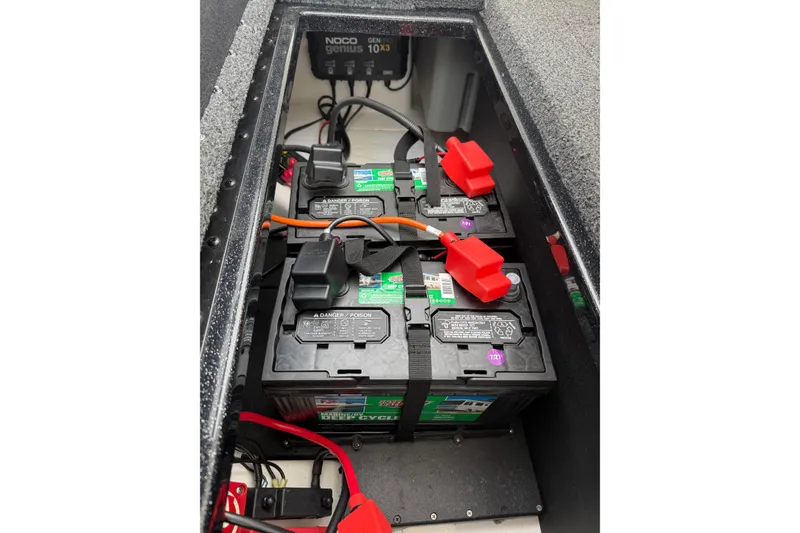 Slide: The Image of Battery compartment of 2022 Nitro Z18 boat with NOCO Genius charger. - 14