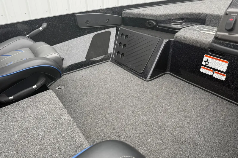 Slide: The Image of Interior of a 2022 Nitro Z18 boat with carpeted flooring and seating. - 4
